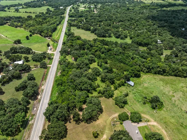 a house with swimming pool in front of it