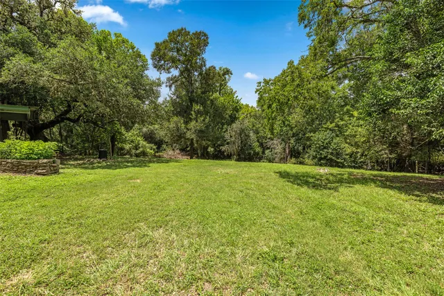 a house with swimming pool in front of it