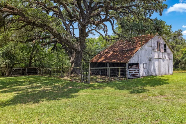 a view of a backyard with a small cabin