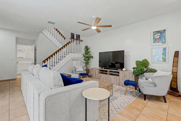 a living room with furniture and a flat screen tv