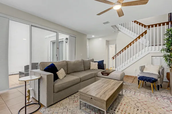 a living room with furniture and a rug