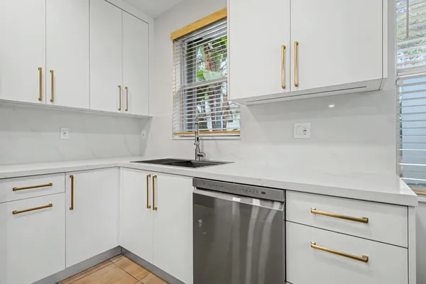 a kitchen with stainless steel appliances a refrigerator stove and microwave