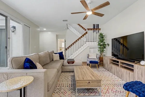 a living room with furniture and a flat screen tv