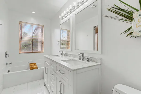 a bathroom with a sink a vanity and a mirror