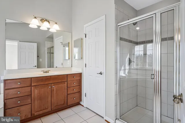 a bathroom with a double vanity sink and mirror