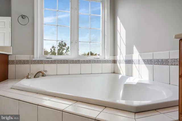 a bathroom with a bathtub and sink