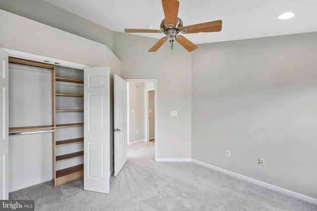 a view of empty room with closet