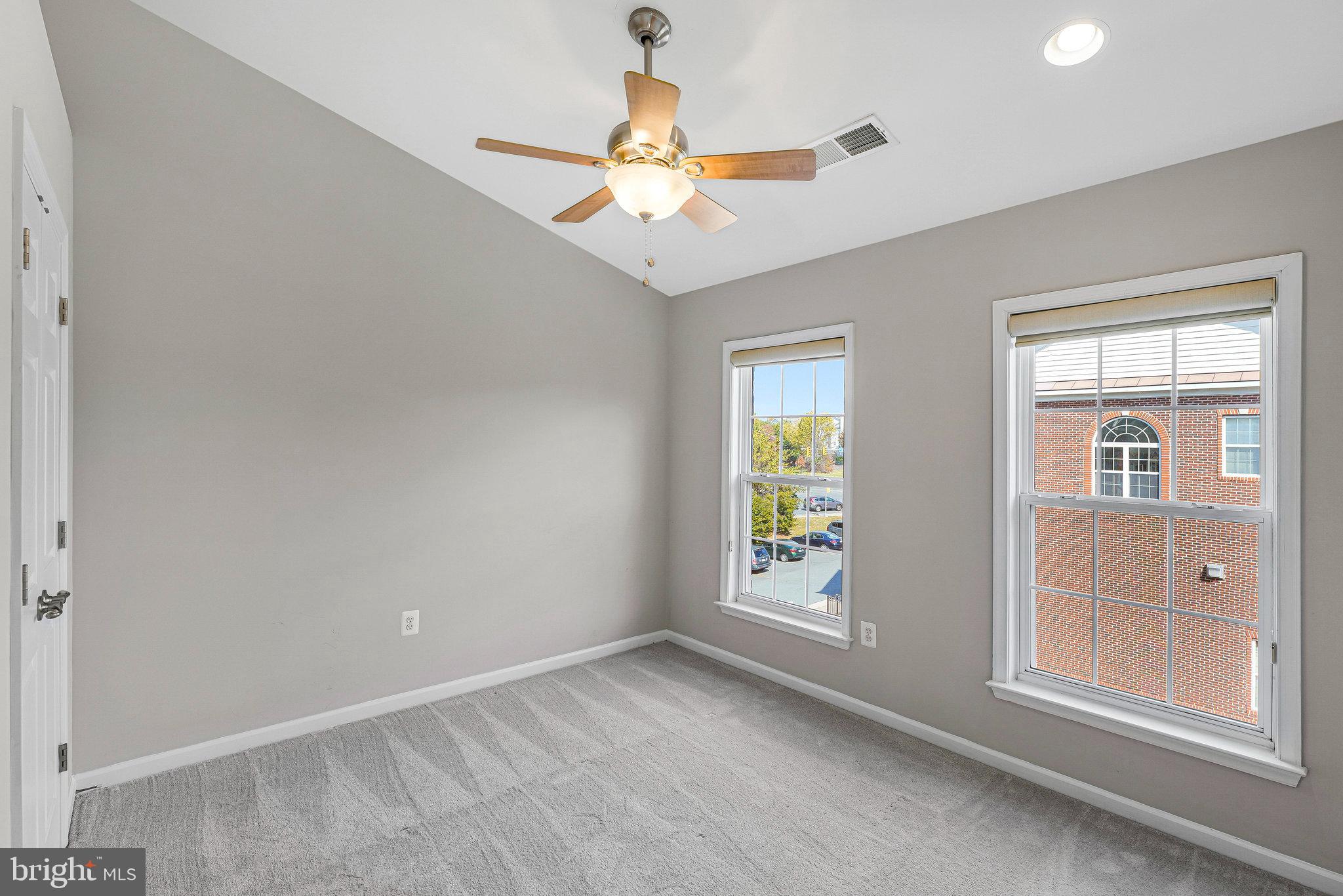 2478 Silk Court Herndon, VA 20171 - Photo 23 of 32 an empty room with windows and fan
