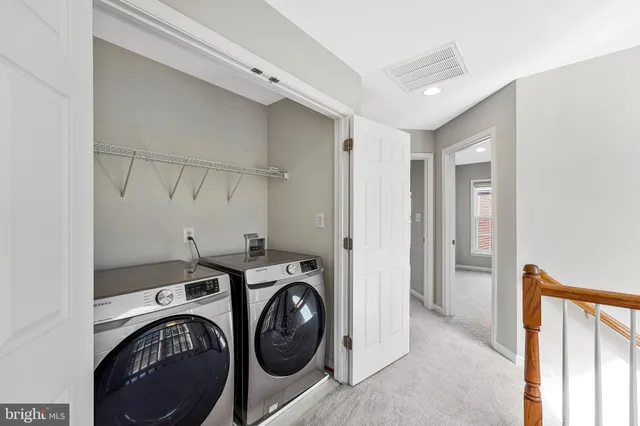 a view of a storage & utility room with washer and dryer