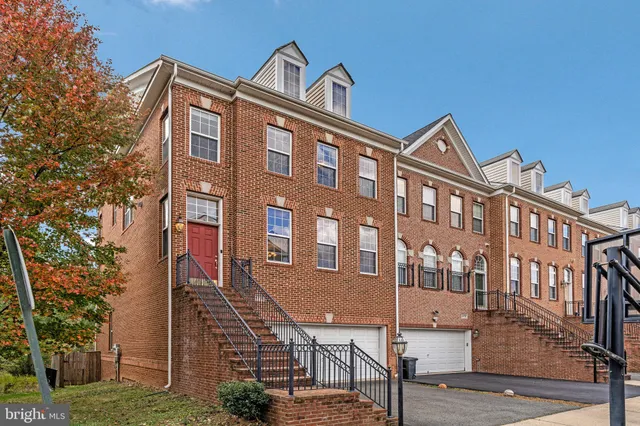 a front view of a building with garden