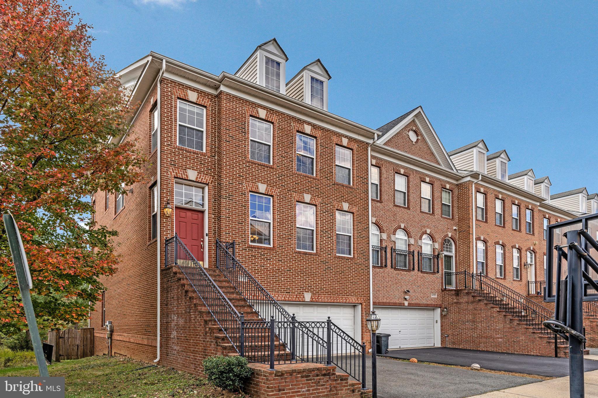 2478 Silk Court Herndon, VA 20171 - Photo 3 of 32 a front view of a building with garden