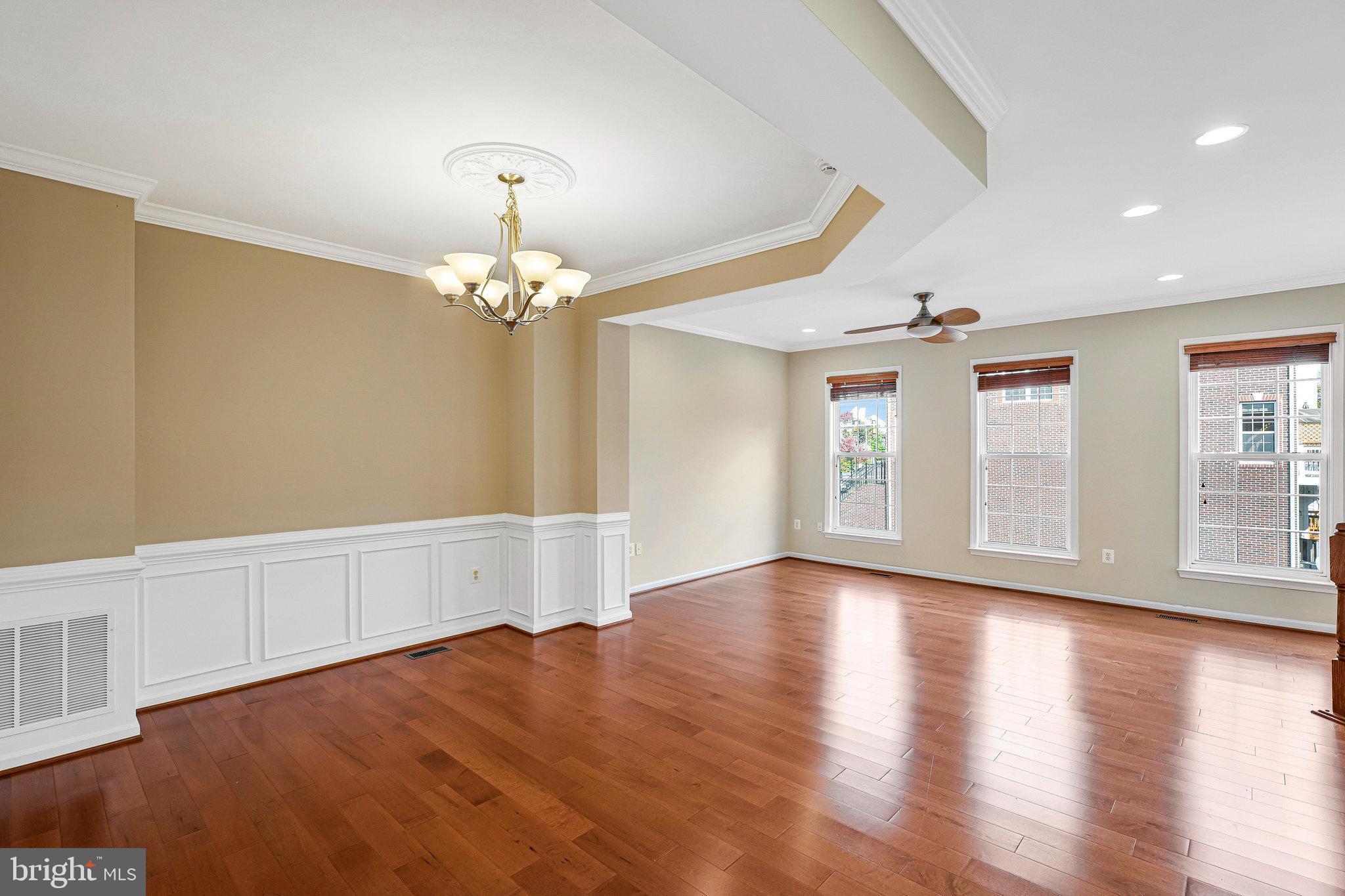 2478 Silk Court Herndon, VA 20171 - Photo 6 of 32 a view of an empty room with wooden floor and a window