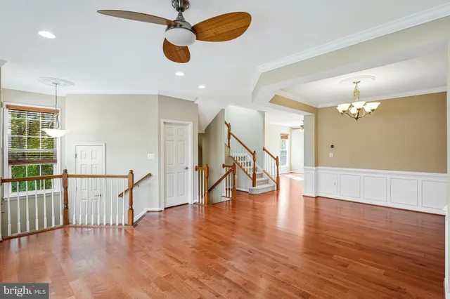 a view of an empty room and wooden floor