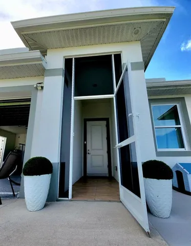 a view of a hallway with chairs