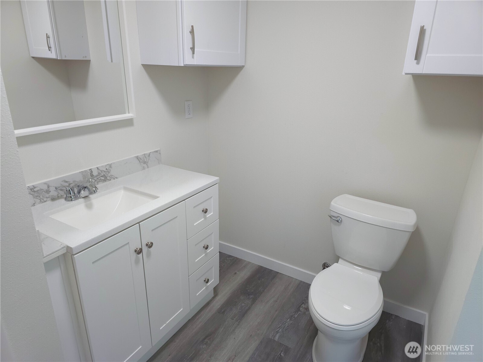 1303 30th Street, Unit 23 Seaview, WA 98644 - Photo 12 of 24 a bathroom with a sink toilet and vanity