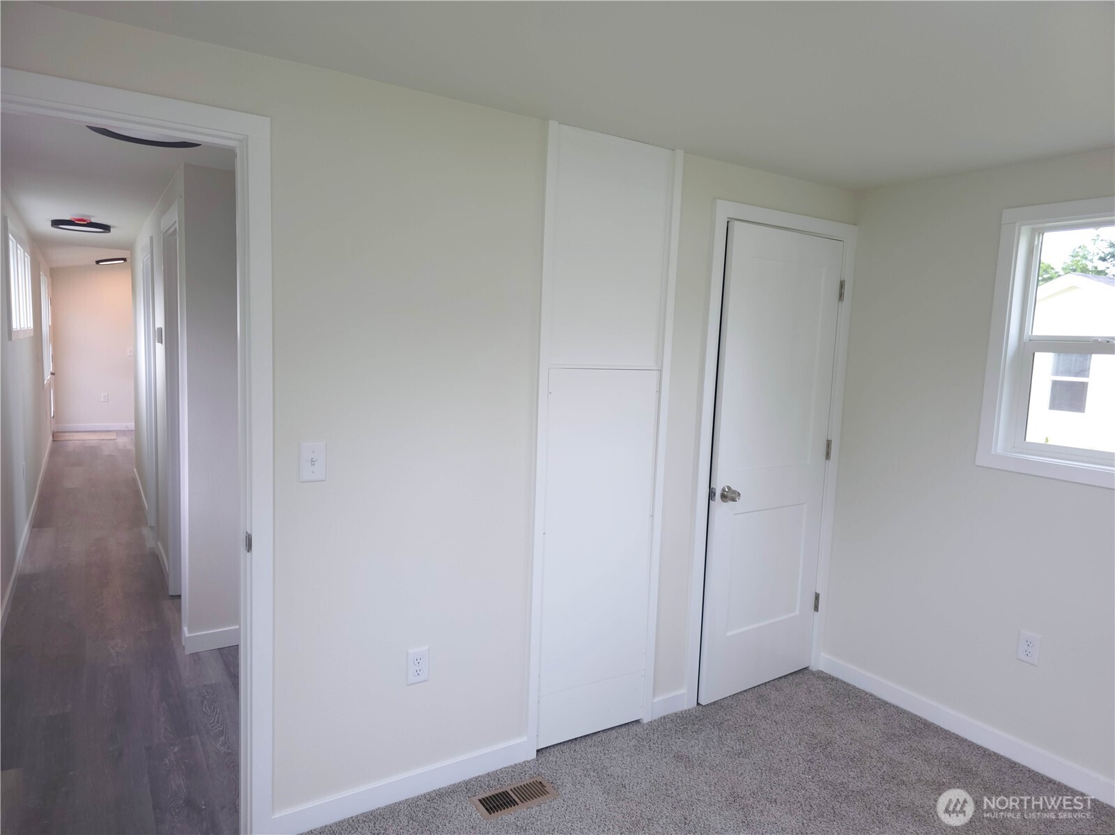 1303 30th Street, Unit 23 Seaview, WA 98644 - Photo 19 of 24 an empty room with windows and closet