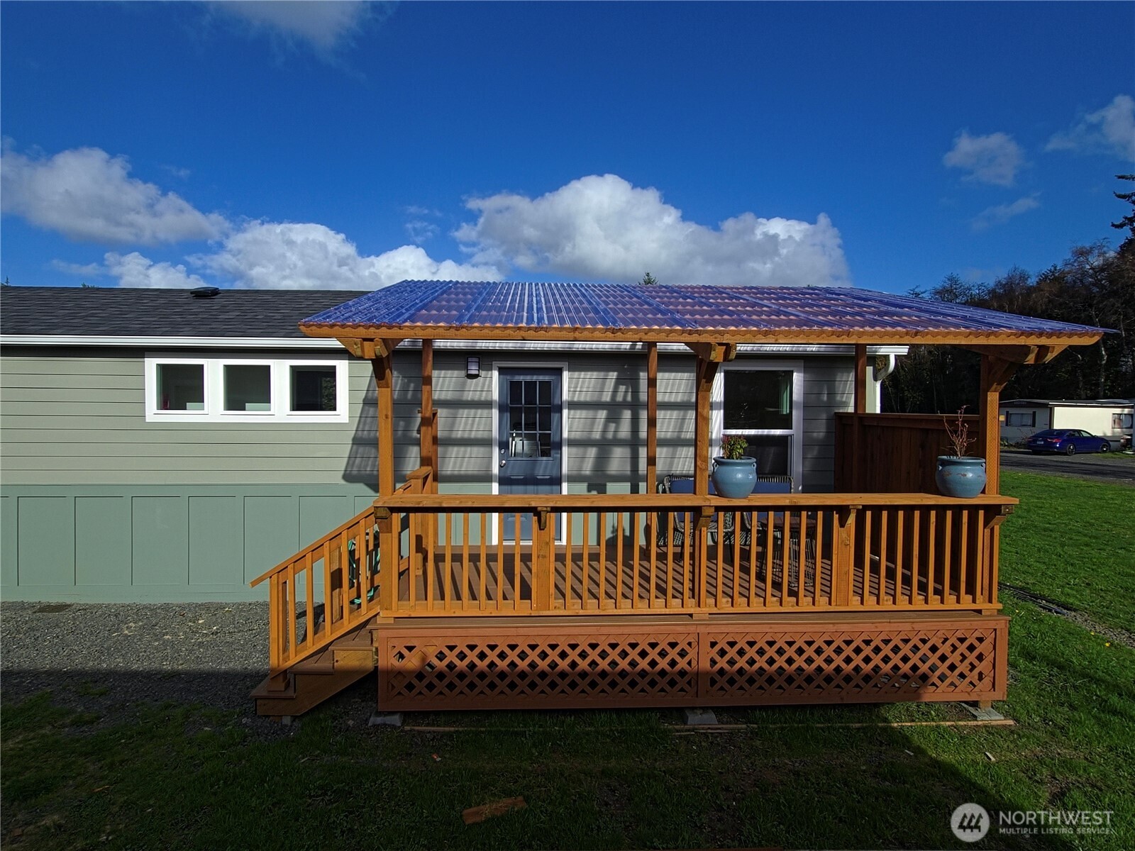 1303 30th Street, Unit 23 Seaview, WA 98644 - Photo 2 of 24 a view of a house with a yard