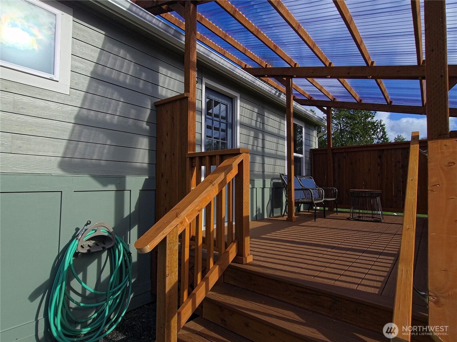 1303 30th Street, Unit 23 Seaview, WA 98644 - Photo 21 of 24 a view of balcony with wooden floor and stairs
