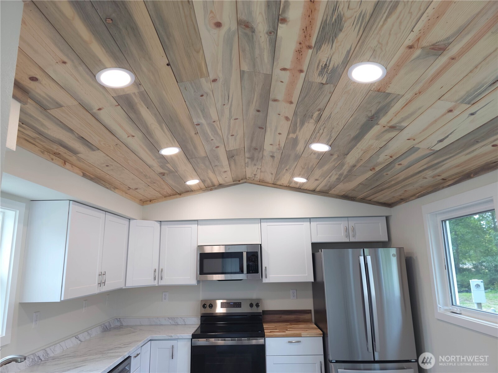 1303 30th Street, Unit 23 Seaview, WA 98644 - Photo 8 of 24 a view of kitchen with furniture and steel appliances