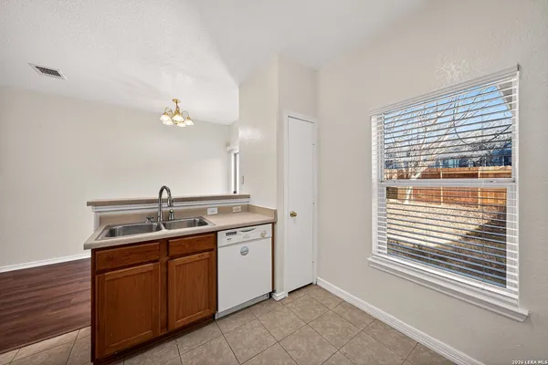a kitchen with a sink and a window