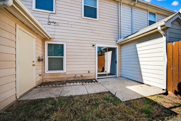 a view of house with backyard and window