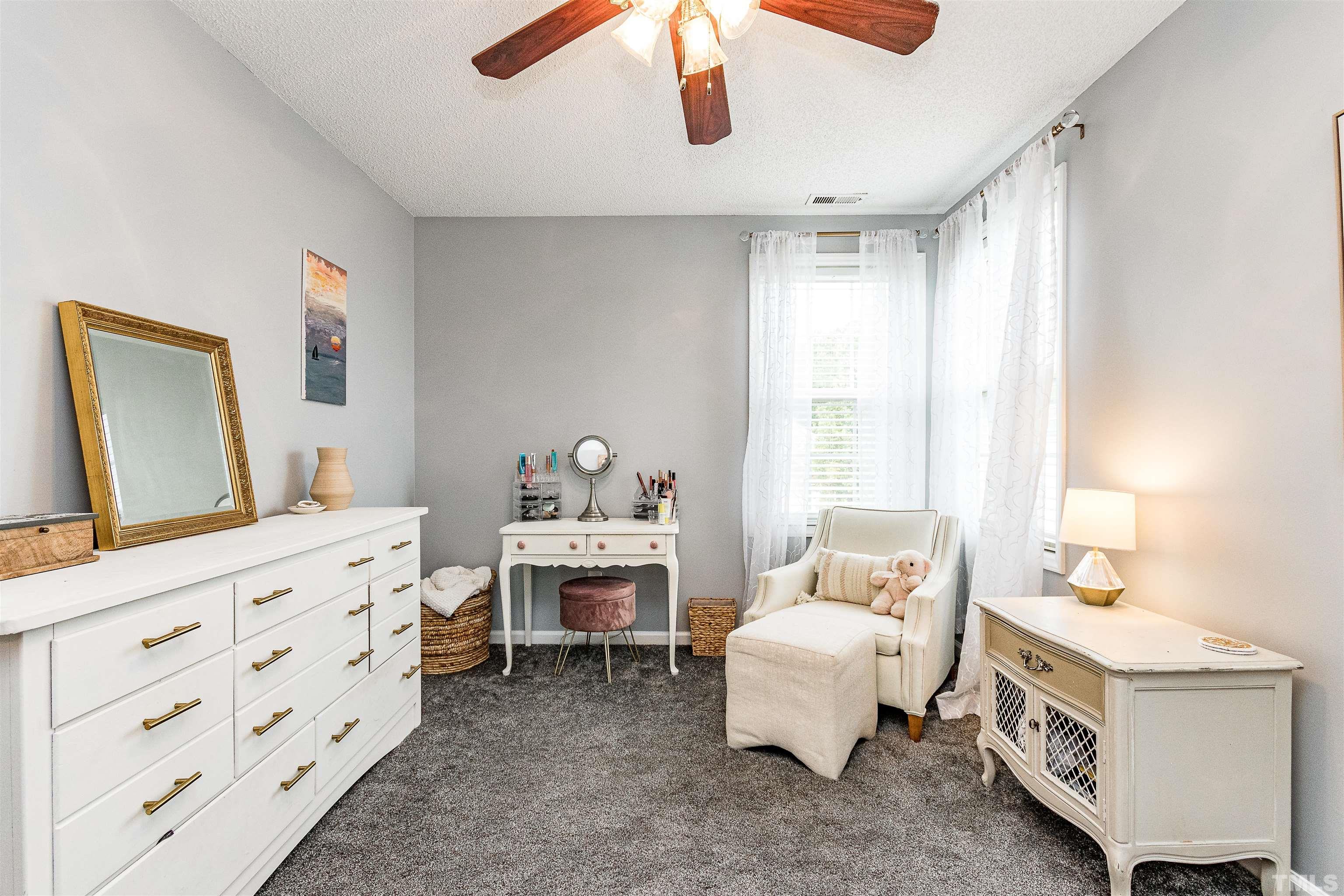 4924 Mocha Lane Raleigh, NC 27616 - Photo 15 of 16 a bedroom with furniture and a window