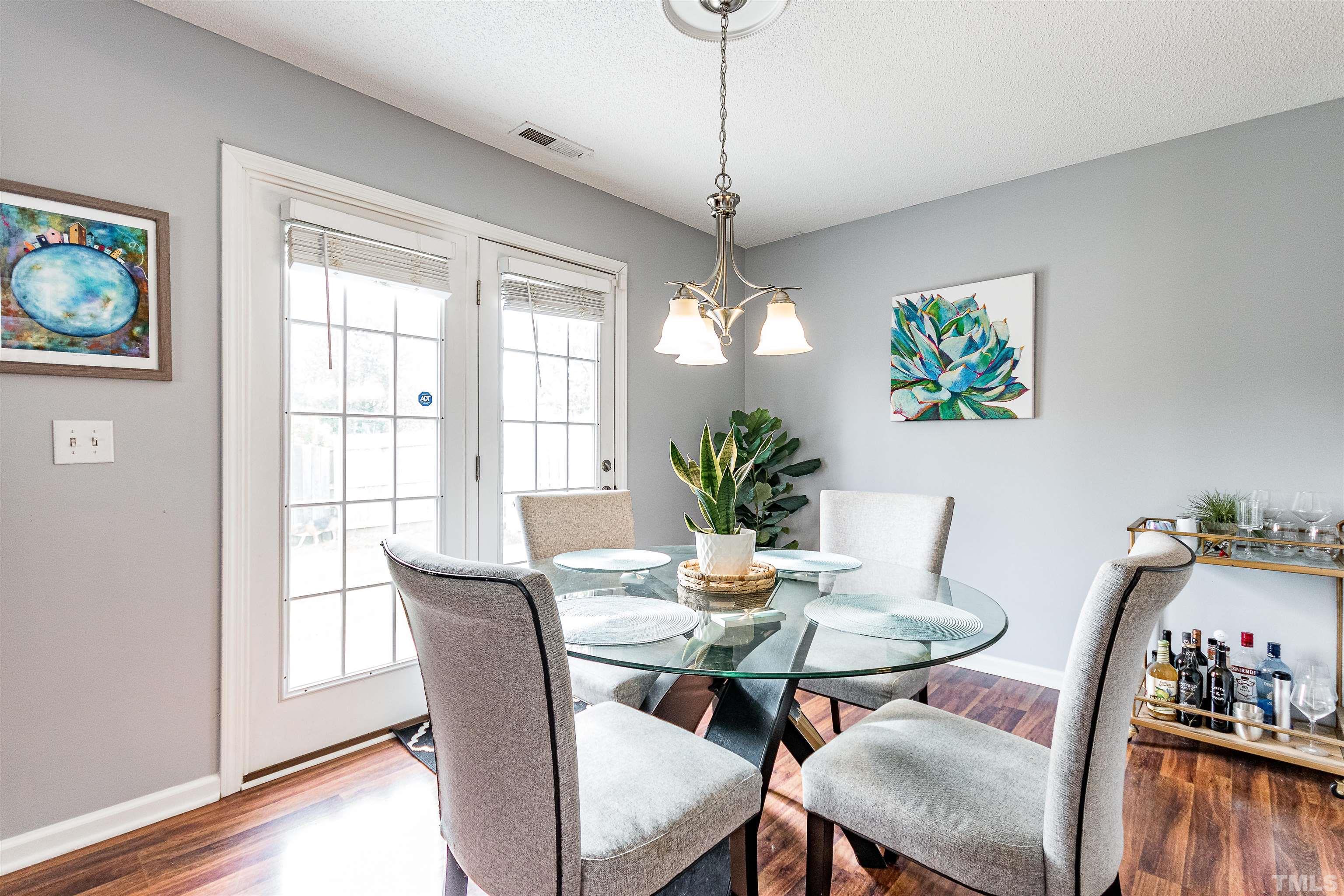 4924 Mocha Lane Raleigh, NC 27616 - Photo 6 of 16 a view of a dining room with furniture window and wooden floor