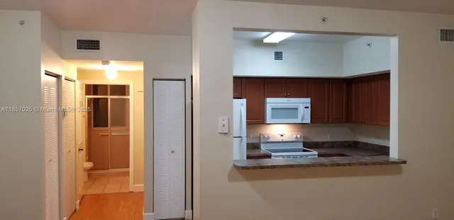 a room with a chair and a fireplace