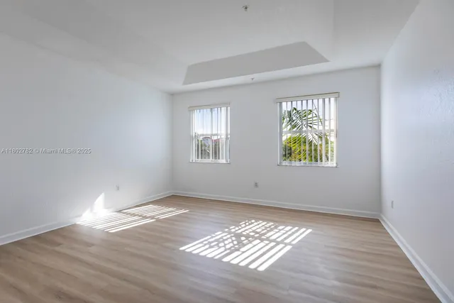 a bathroom with a toilet a sink a tub and mirror