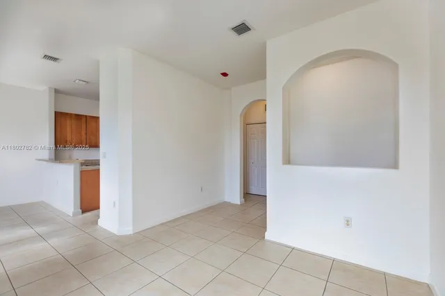 a view of a kitchen with a sink and cabinets