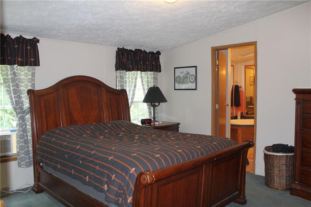 178 Stevens Pond Road Liberty, ME 04949 - Photo 13 of 24 Master bedroom lust off the living...