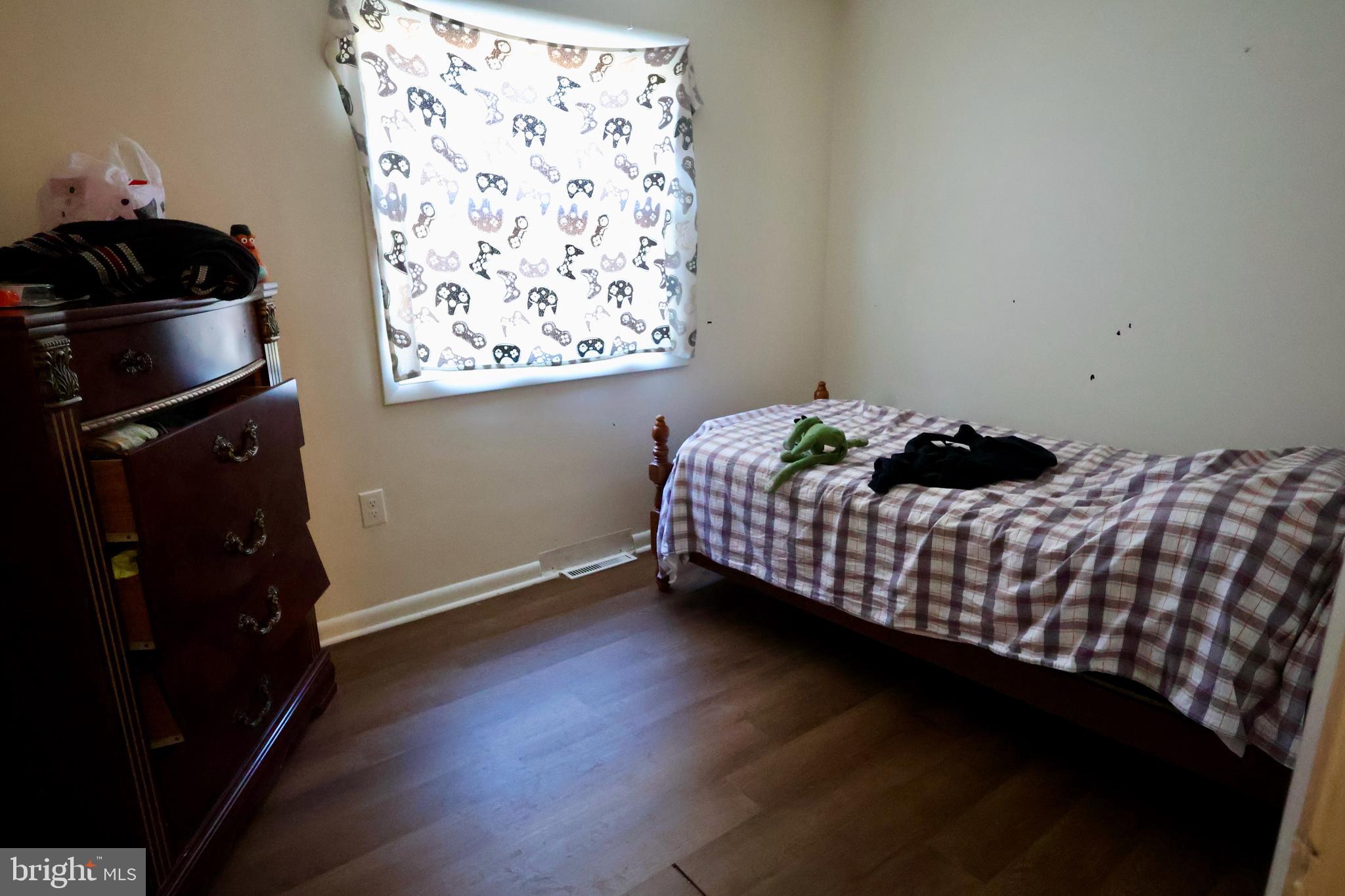 1239 Wabank Road Lancaster, PA 17603 - Photo 19 of 31 a bedroom with a bed and wooden floor