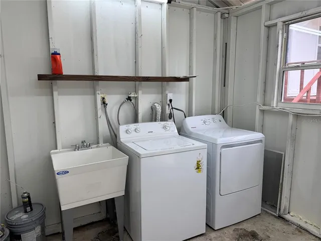 a utility room with dryer and washer