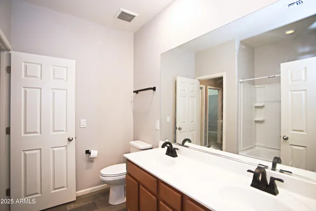 a bathroom with a tub a sink and a mirror