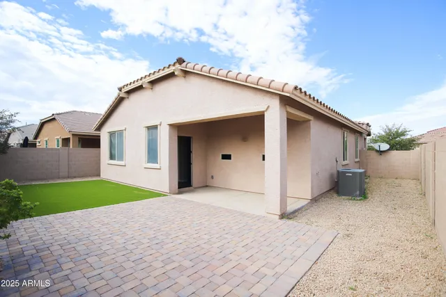a house with a yard and a garage