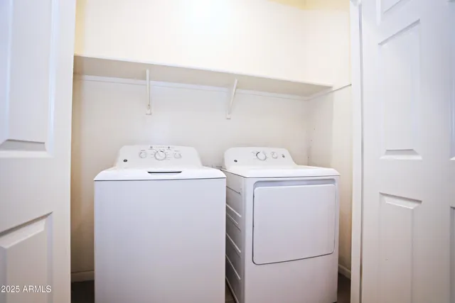 a view of swimming pool with a garden and trees