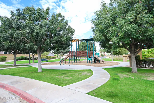 a view of a house with porch and garden