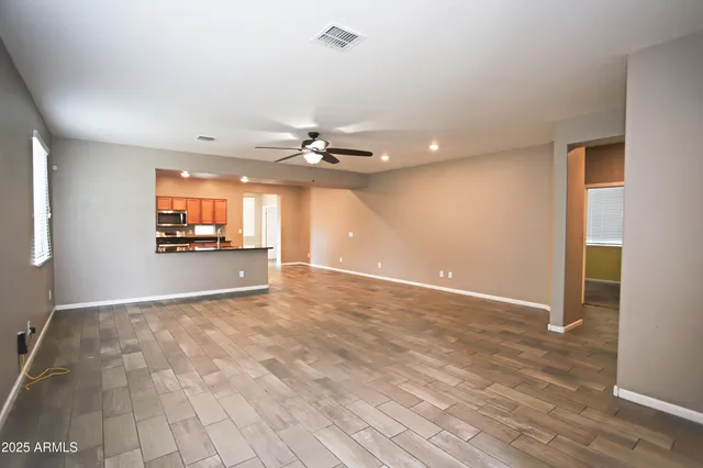 a view of kitchen with sink and wooden floor