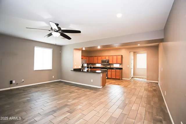 a kitchen with granite countertop a sink and a stove