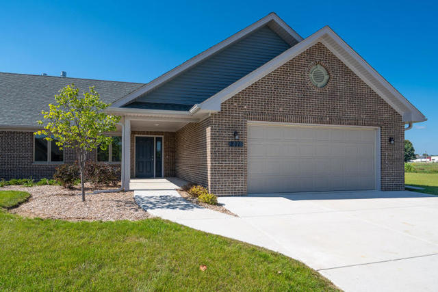 211 Windmill Lane Walworth, WI 53184 - Photo 1 of 1 a front view of house with yard and glass windows