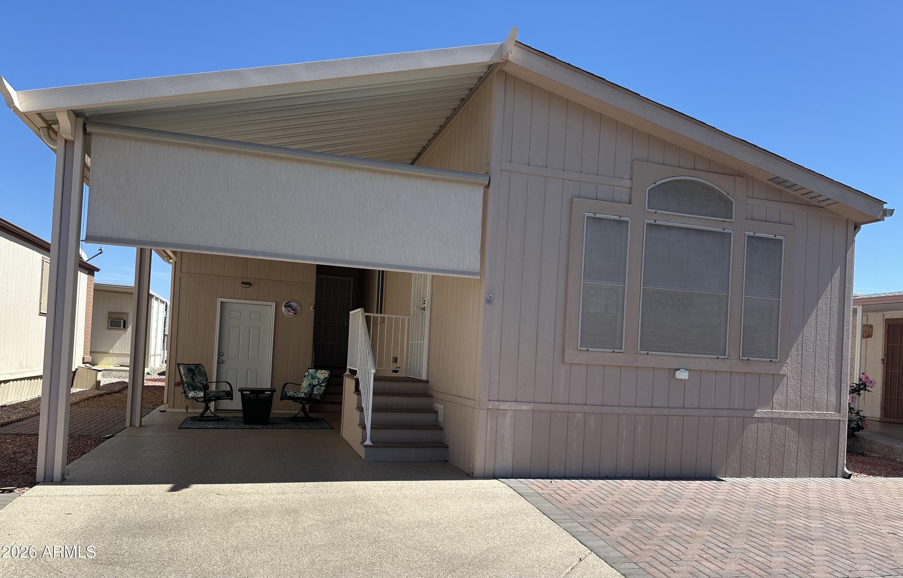17200 West Bell Road, Unit 1658 Surprise, AZ 85374 - Photo 1 of 16 a house view with a outdoor space