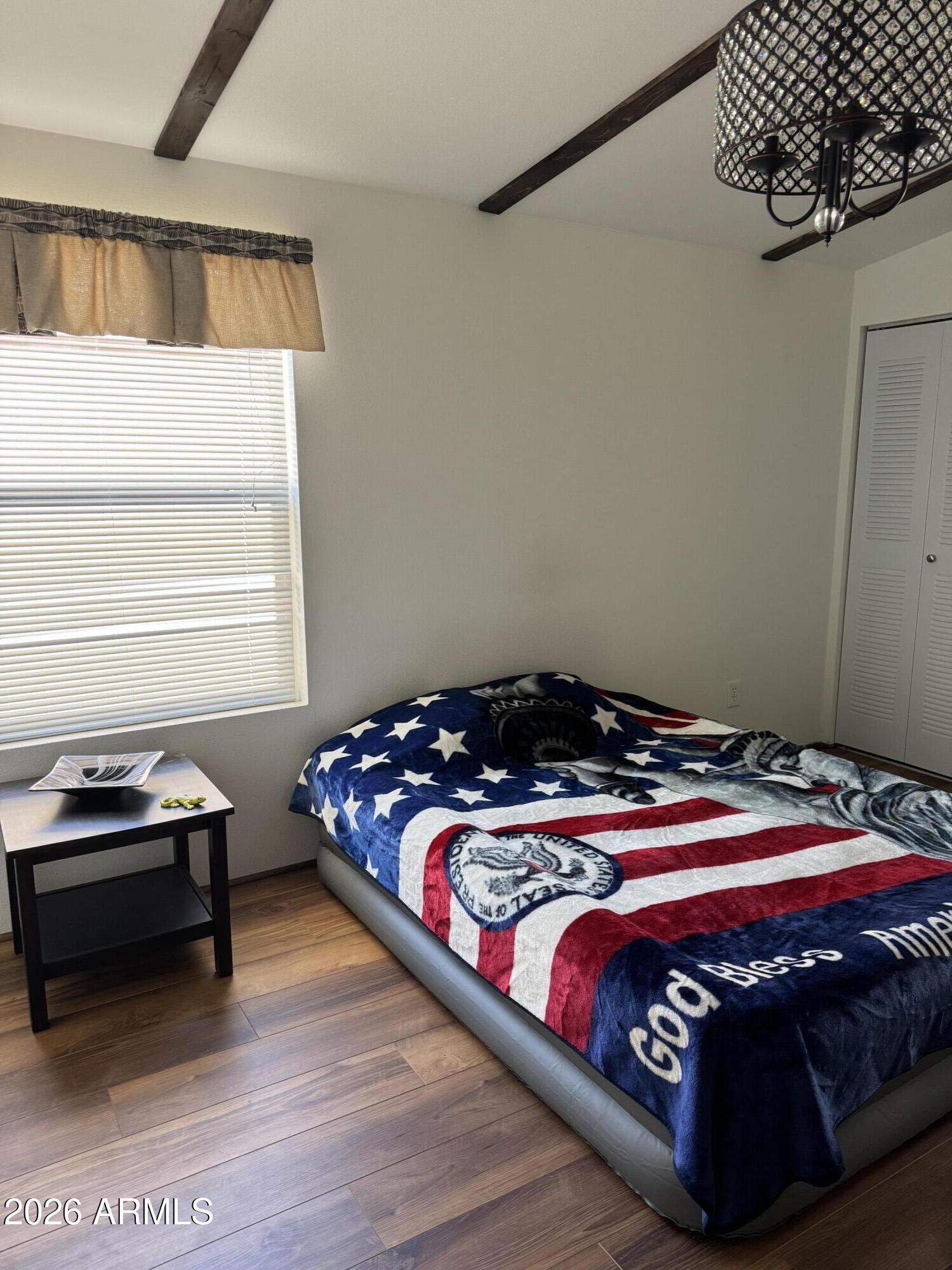 17200 West Bell Road, Unit 1658 Surprise, AZ 85374 - Photo 15 of 16 a bedroom with a bed and a window