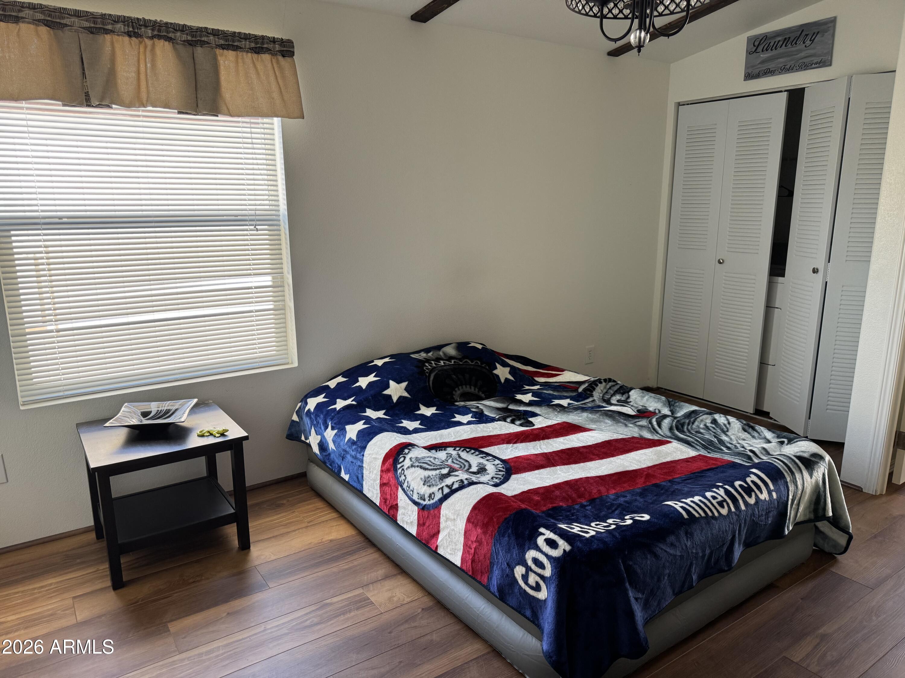 17200 West Bell Road, Unit 1658 Surprise, AZ 85374 - Photo 16 of 16 a bedroom with a bed and a window