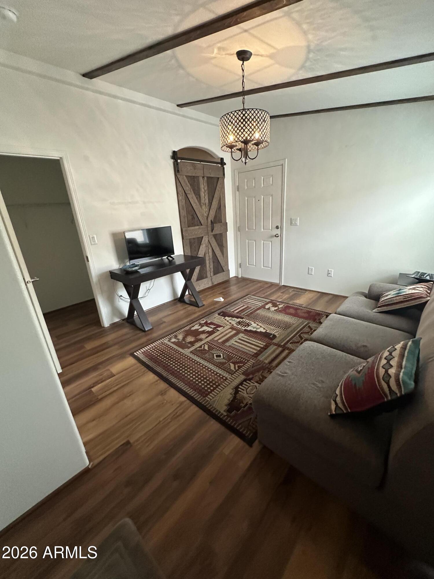 17200 West Bell Road, Unit 1658 Surprise, AZ 85374 - Photo 10 of 16 a bedroom with a bed dresser and a dining table