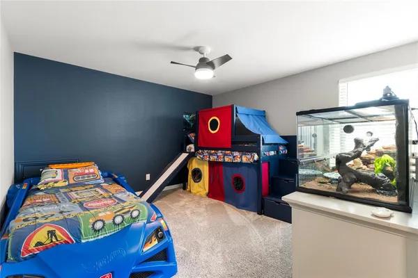 a bedroom with a bed that has a bed in it