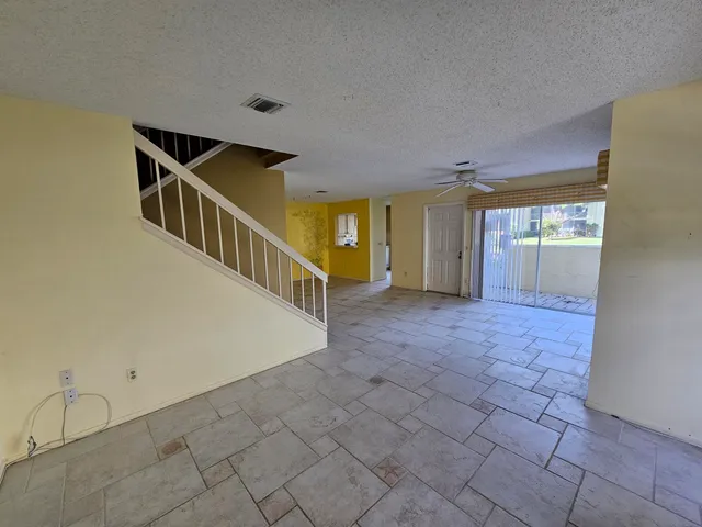 a view of an empty room with windows