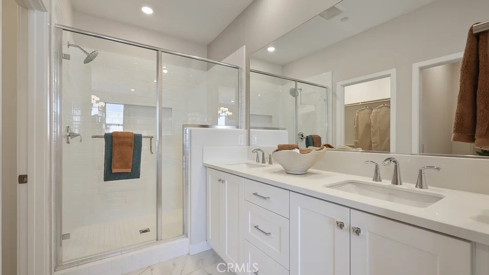 925 Walnut Terrace Montebello, CA 90640 - Photo 15 of 33 a bathroom with a double vanity sink mirror and shower
