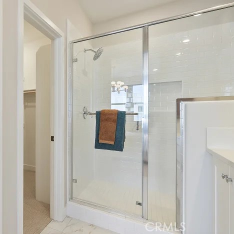 925 Walnut Terrace Montebello, CA 90640 - Photo 16 of 33 a bathroom with a shower and a glass door