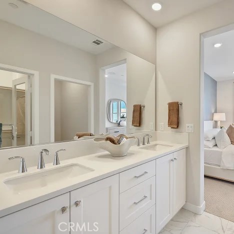 925 Walnut Terrace Montebello, CA 90640 - Photo 17 of 33 a bathroom with a sink double vanity and mirror