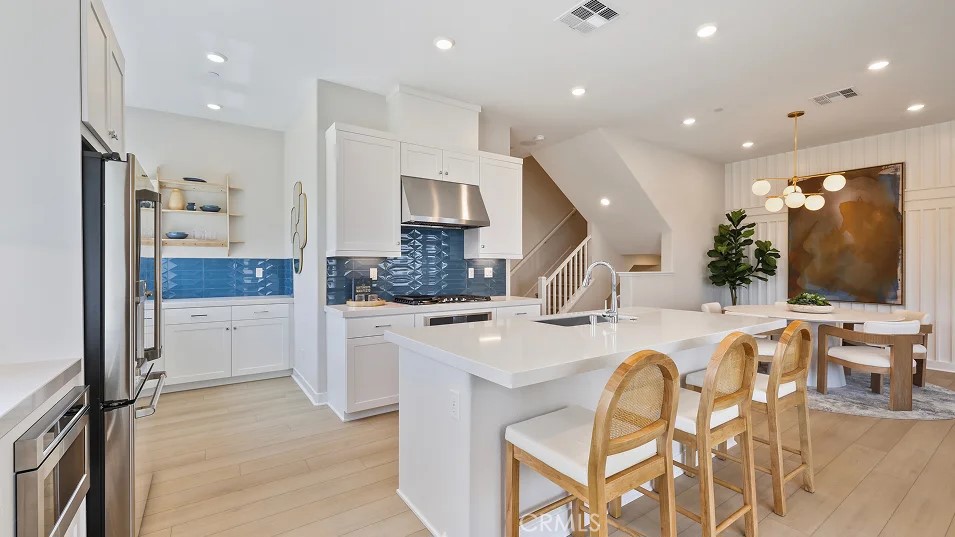 925 Walnut Terrace Montebello, CA 90640 - Photo 2 of 33 a large kitchen with a table and chairs